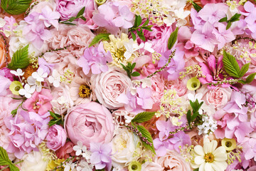 Delicate blooming festive roses and pink summer flowers, blossoming rose flower soft pastel background, bouquet floral card