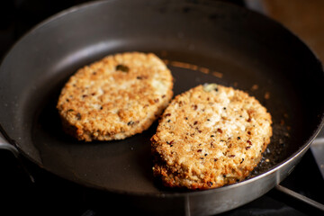 Vegetarian meatballs. Cooking in a pan. Meat alternative food. Cutlets from beans, seeds.