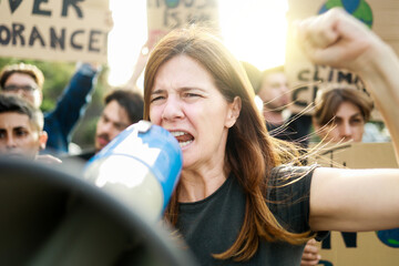 Earth day activist: Group of people protests for climate change in the city - Global warming...