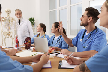 Doctor giving lecture for interns in university