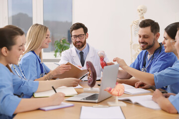 Doctor giving lecture for interns in university