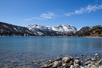 Snow tops the Sierra Nevada Mountains from the crystal clear waters of June Lake, which sits at the bottom of the mountain range's steep eastern escarpment