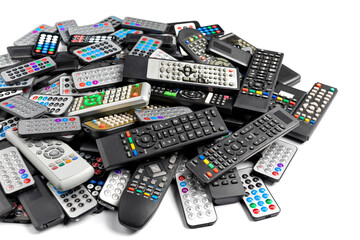 A pile of remote controls isolated on a white background, remote control devices for television