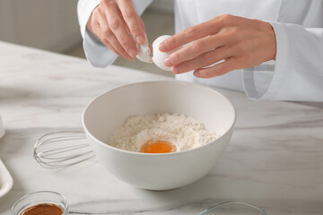 Professional chef making dough at white marble table indoors, closeup