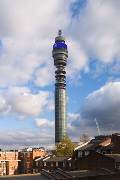 London, UK - February 27, 2023; BT Tower landmark rising against blue sky with partially cloudy sky over buildings