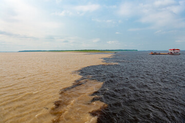nature waterscape of amazon and rio negro river. photo of nature waterscape meeting waters.