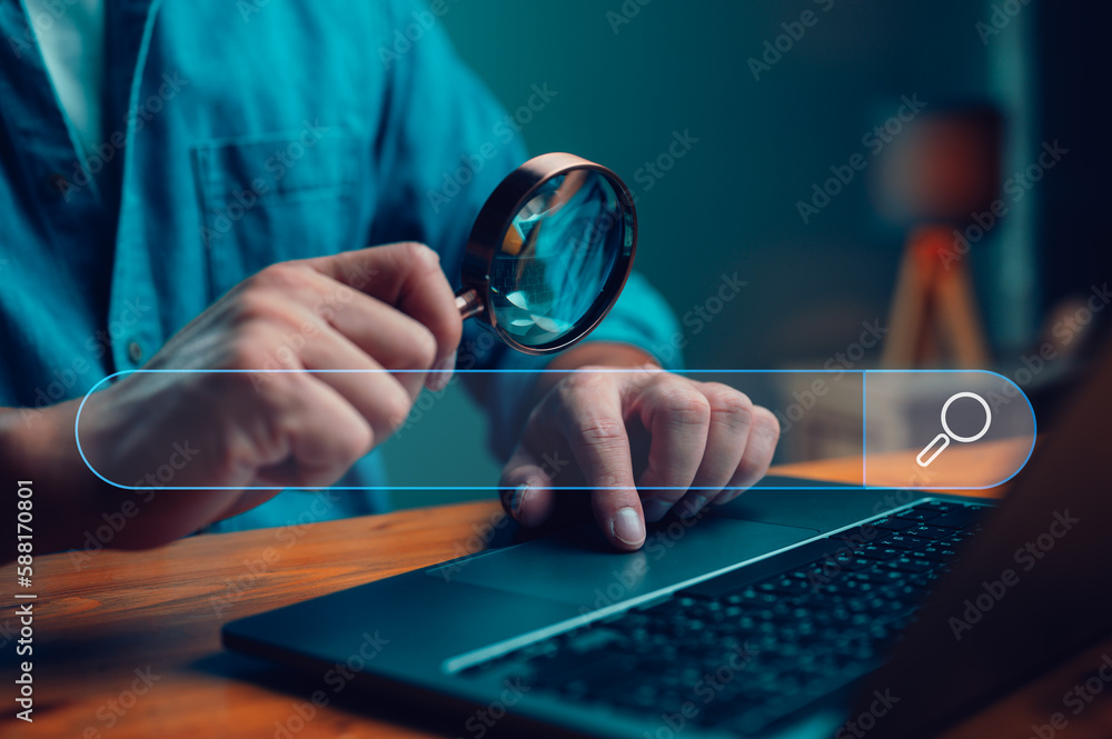 Leinwandbilder Businessman use magnifying glass Search On Virtual Screen Data Search Technology Search Engine Optimization. Man use computer to Searching for information. Using Search Console for data, info.