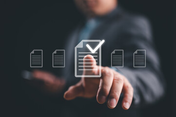 Businessman touching on virtual screen to tick mark document for online approve paperless quality assurance and ERP management, Prepare check and approve concept. Document management, paperless.