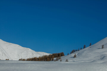 View from Jazator river valley to South Chui ridge in winter day. Russia South Of Western Siberia, Altai Mountains. Desert mountains covered with snow near village of Djazator