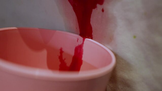 Blood dripping from an open wound