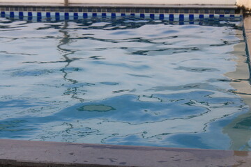 A pool on a rooftop of a hotel in close up
