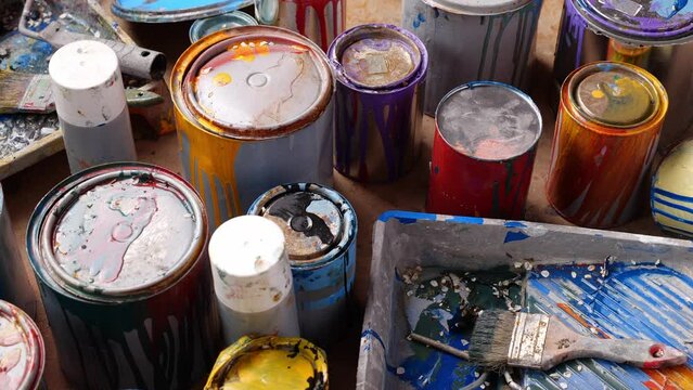Old Paint Cans Waste. Cans of colored paint. Oil-based enamel, lacquer, shellac and varnish. Household Hazardous Waste