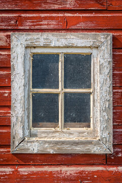 Closeup of a window on an old, weathered barn on the prairies in Saskatchewan