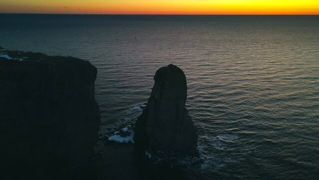 Drone view at sunrise of famous perce rock in Perc&eacute;, Qu&eacute;bec, Canada