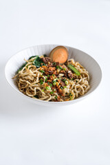 bakmi, noodle soup in white bowl
