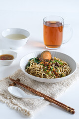 bakmi, noodle soup in white bowl
