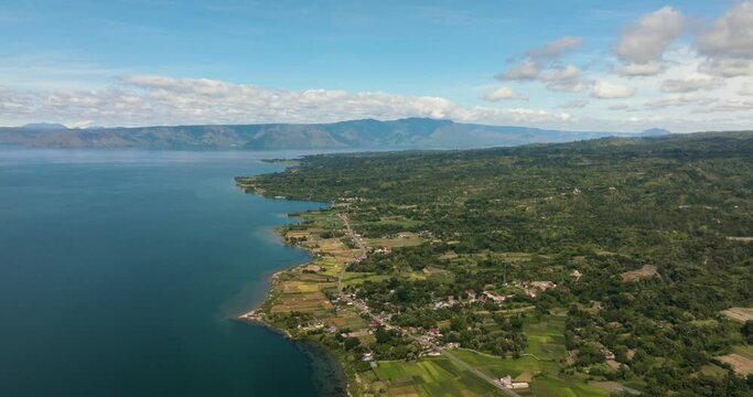 Aerial drone of Samosir is a large volcanic island in Lake Toba, located in the north of the island of Sumatra in Indonesia