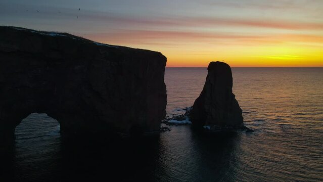 Drone view at sunrise of famous perce rock in Perc&eacute;, Qu&eacute;bec, Canada