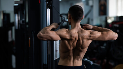 Fototapeta na wymiar Man Thrust of the upper block to the chest in the gym.