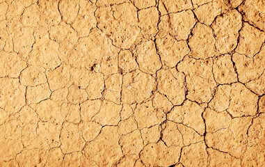 Cracked ground background in the top view for graphic design or wallpaper