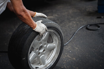Close up the old tire at the repair garage.Repair car service concept.