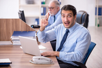 Two male colleagues working in the office