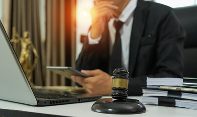 judge on wooden table And experienced lawyers meet with clients and give advice behind the scenes. legal services legal consulting concept