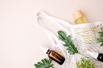 The skincare and natural beauty product in a sustainable and eco-friendly bag with green leaves on...