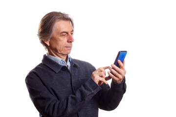 An elderly man confidently uses a smartphone.