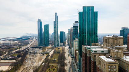 aerial footage captures skyline of downtown Chicago from a bird's-eye view. The sprawling cityscape...