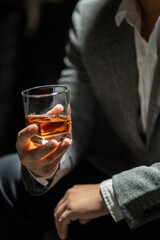 Businessman pouring whiskey victory drink