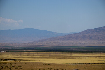 Fototapeta na wymiar Arriving in the San Joaquin Valley after passing through the Tehachapi Mountains north of Los Angeles
