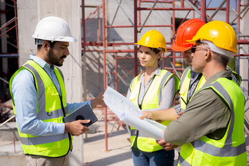 Team group of contractor and architect with foreman explaining about scheme building site for...