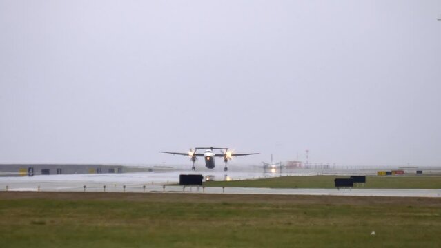 Turboprop Propeller Aircraft Taking Off and Climbing, Tracking Shot.