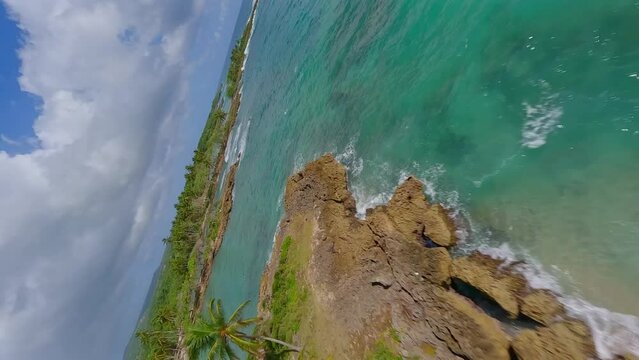 Los Coquitos beach, Cabrera in Dominican Republic. Aerial fpv and vertical format