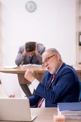 Fototapeta premium Two male colleagues sitting in the office