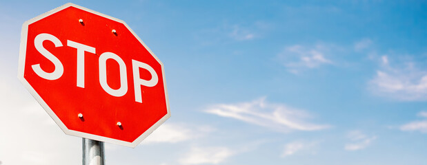 Stop Traffic Sign and blue sky. red warning icon