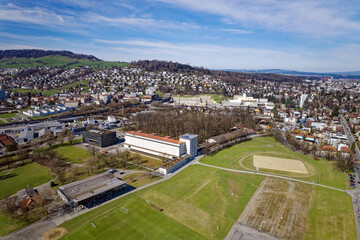 Fototapeta na wymiar Aerial view of City of Luzern with scenic landscape on a blue cloudy spring day. Photo taken March 22nd, 2023, Lucerne, Switzerland.