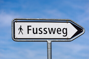 City of Luzern, Canton Luzern, with black and white road sign with text footpath with blue cloudy sky background on a sunny spring day. Photo taken March 22nd, 2023, Lucerne, Switzerland.