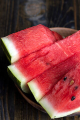 Sliced red and ripe watermelon on the table