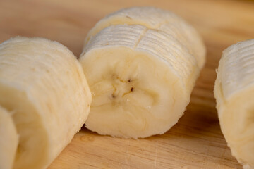 a ripe sweet banana cut into pieces lies on the table
