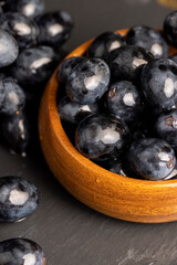 sweet ripe black grapes covered with drops of water
