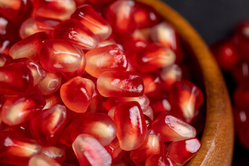 Red ripe pomegranate with red and juicy grains