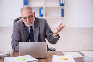 Old male employee and too much work in the office