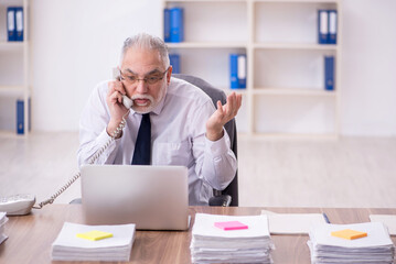 Old male employee and too much work in the office