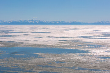 Frozen Lake and Snowy Mountains Winter Landscape