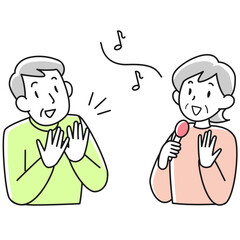 歌うシニア女性と手拍子をとるシニア男性