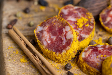 Sliced pork salami with spices and lots of turmeric