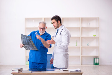 Two male doctors radiologists working in the clinic