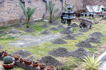 Leveling lawn with a river sand
